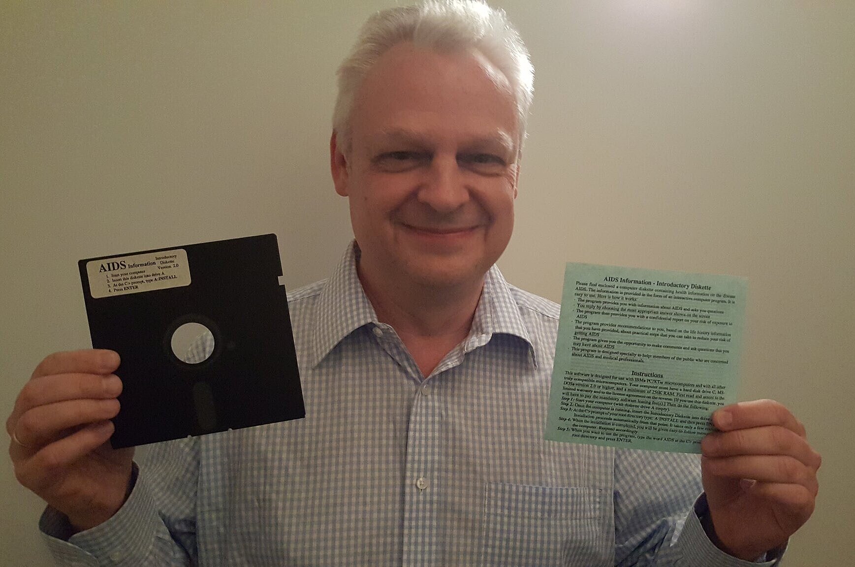 Eddy Willems holding a diskette with the AIDS ransomware